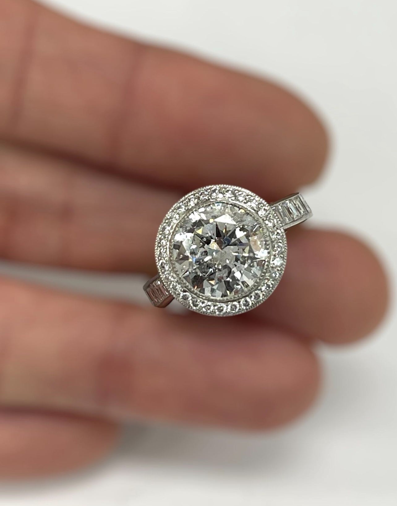 Round Brilliant Halo Engagement Ring with Baguettes Accents