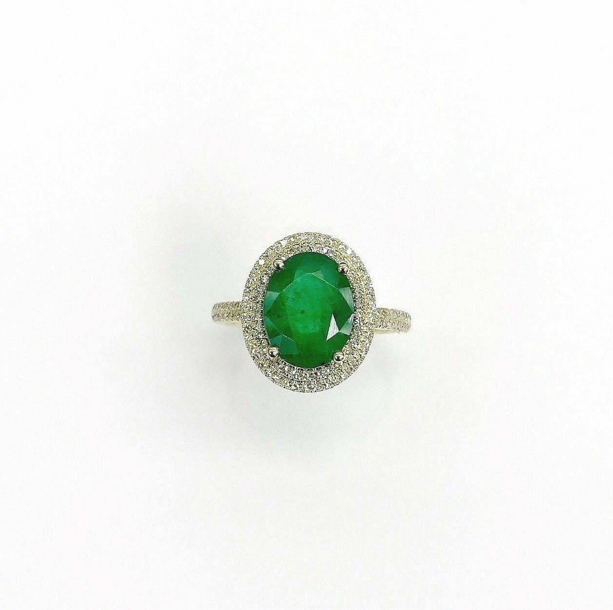 2.95 Carats t.w. Diamond and Emerald Halo Ring Emerald is 2.60 Carats May Stone