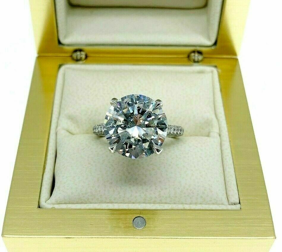 6.31 Carats t.w. F SI2 Round Cut Diamond Under Halo Engagement Ring 5.35 Center