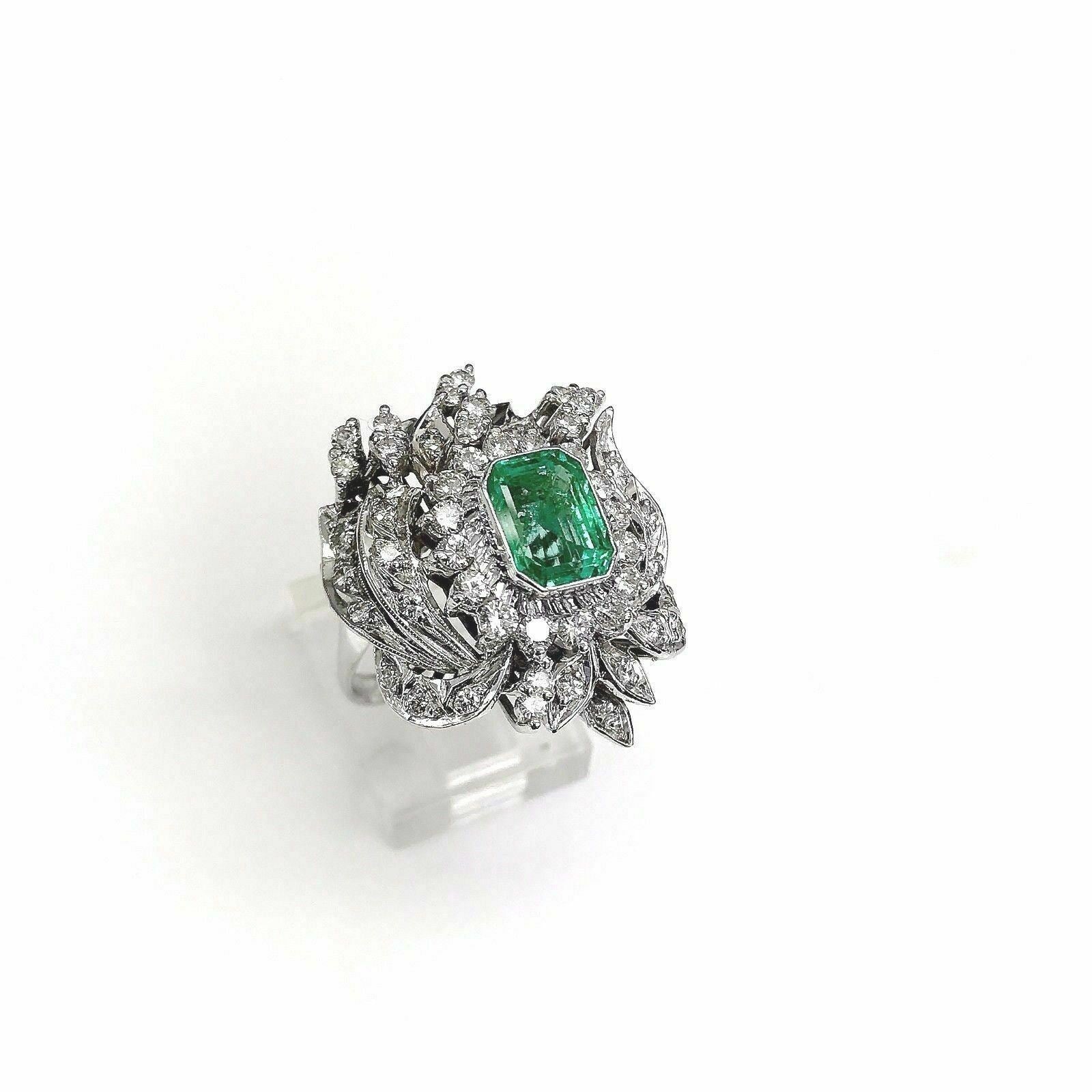 2.88 Carats t.w. Diamond and Emerald Ring Emerald is 1.63 Carats Vintage 1980's