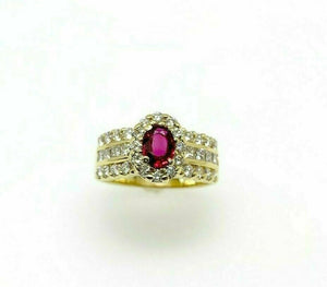 1.45 Carats t.w. Diamond and Oval Ruby Halo Engagement Ring 18K Yellow Gold