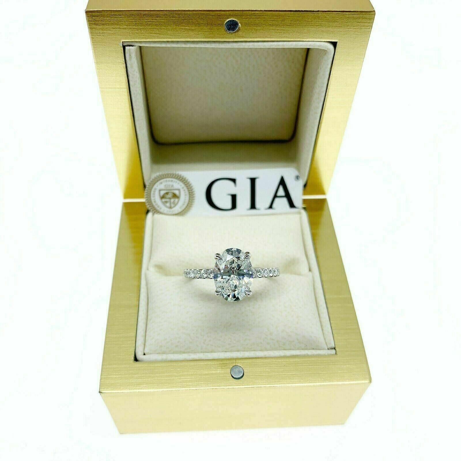 2.39 Carats t.w. Oval GIA F SI1 Under Halo Hand Made Engagement Ring 18K Gold