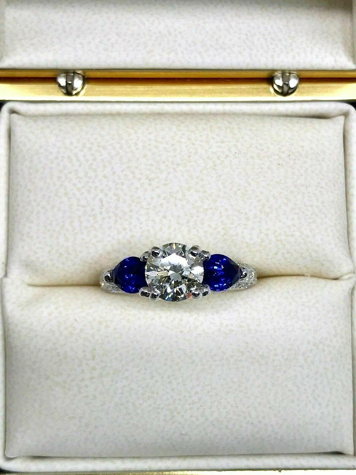 18K White Gold Ring w/EGL Certified 1.29ct RBC Diamond & 2 Pear Shape Blue Sapp