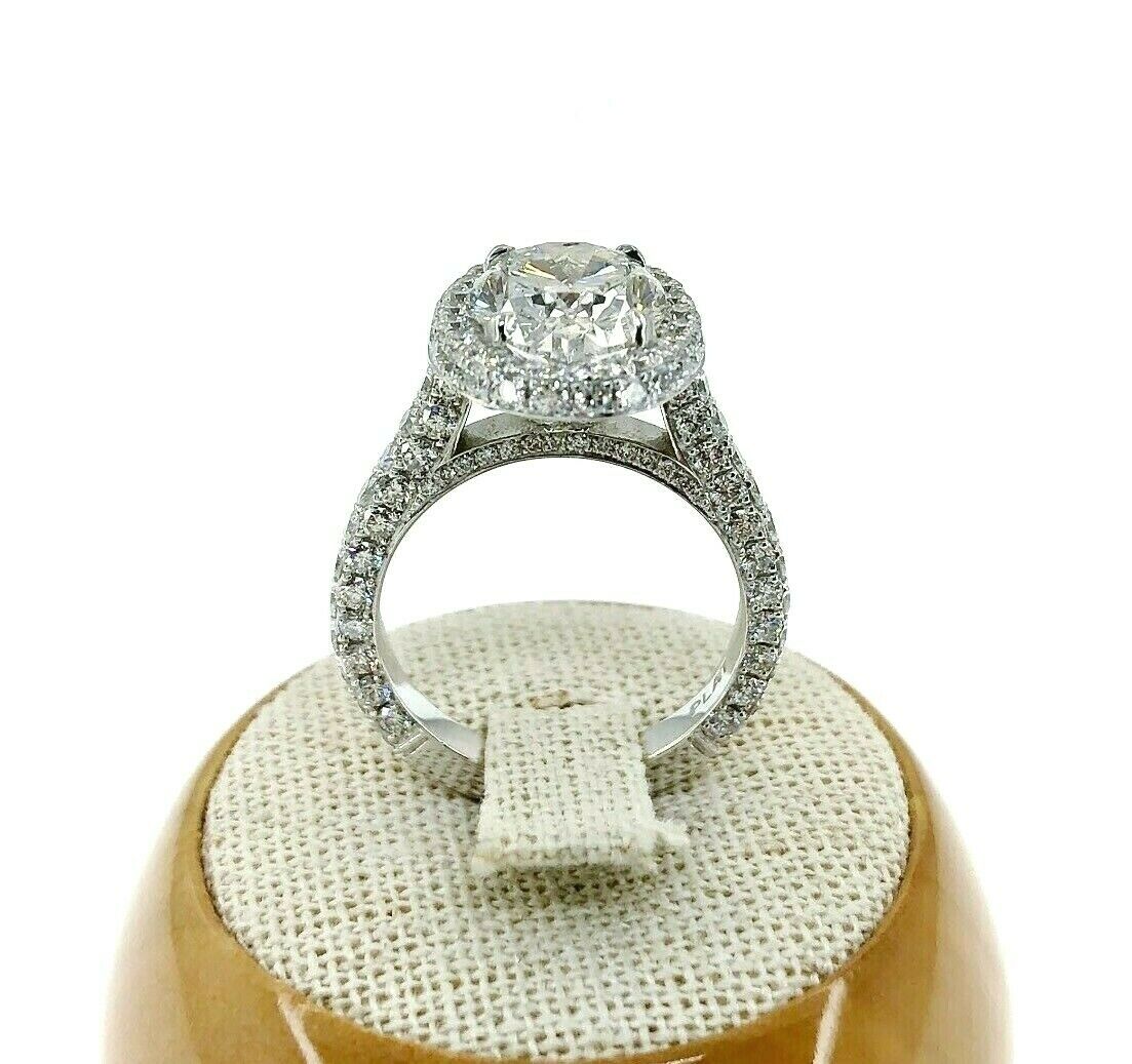 5.46 Carats t.w. Oval Cut Diamond Puffed Halo 3 Sided Pave Engagement Ring Plat