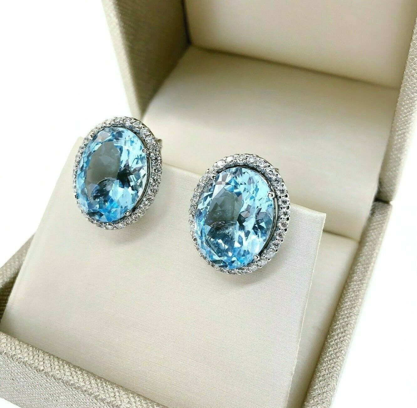 Fine 20.96 Carats t.w. Swiss Blue Topaz and Diamond Halo French Clip Earrings