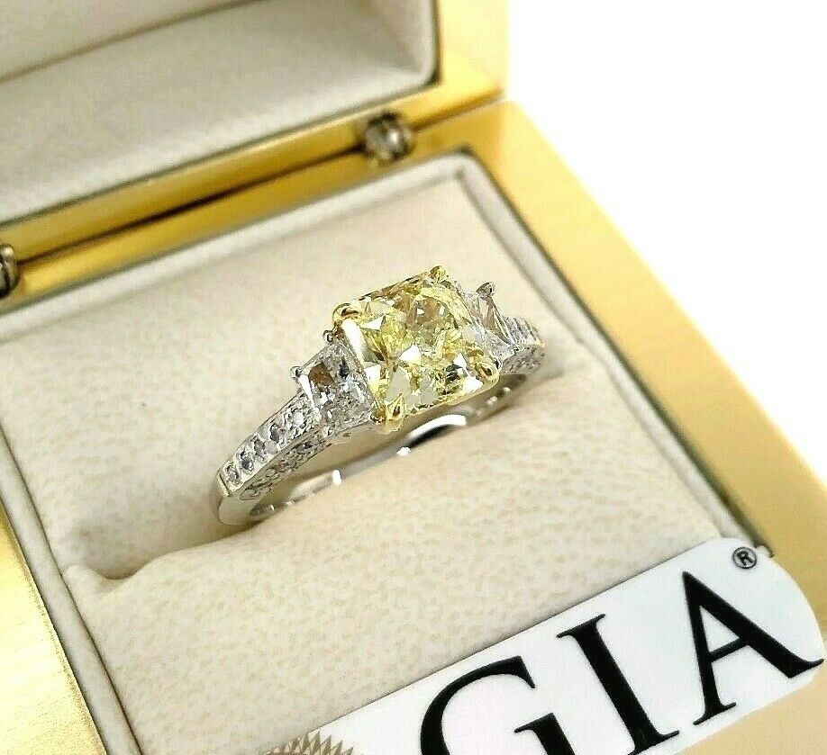 GIA 2.60 Carats t.w. Radiant Fancy Yellow VS1 Trapezoids Diamond Engagement Ring