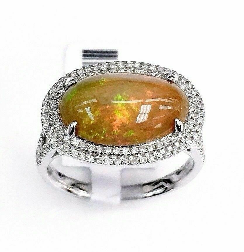 3.23 Carats t.w. Diamond and Opal Halo Ring Opal is 2.85 Carats 14K White Gold