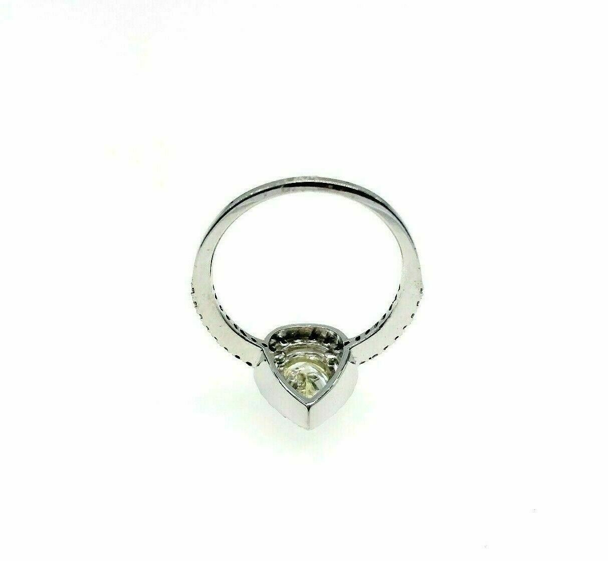 1.18 Carats t.w. Pear Halo Diamond Engagement Ring 0.83 Diamond Center 14K Gold