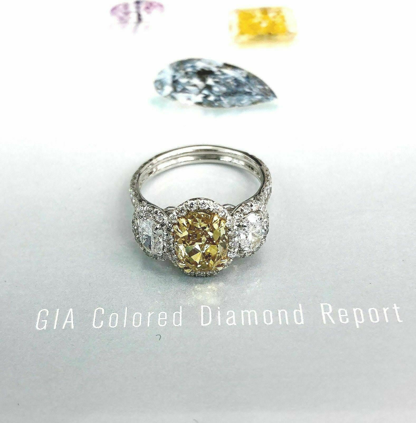 Natural 1.56 Carats GIA Fancy Intense Oval Diamond Ring w Additional 1.32 Carats
