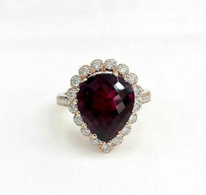 6.49 Carats t.w. Diamond and Ruby Halo Ring Ruby is 5.48 Carats 14K Rose Gold