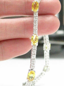 6.08 TCW Round Brilliant Diamonds and Oval Yellow Sapphire Bracelet 14kt WG