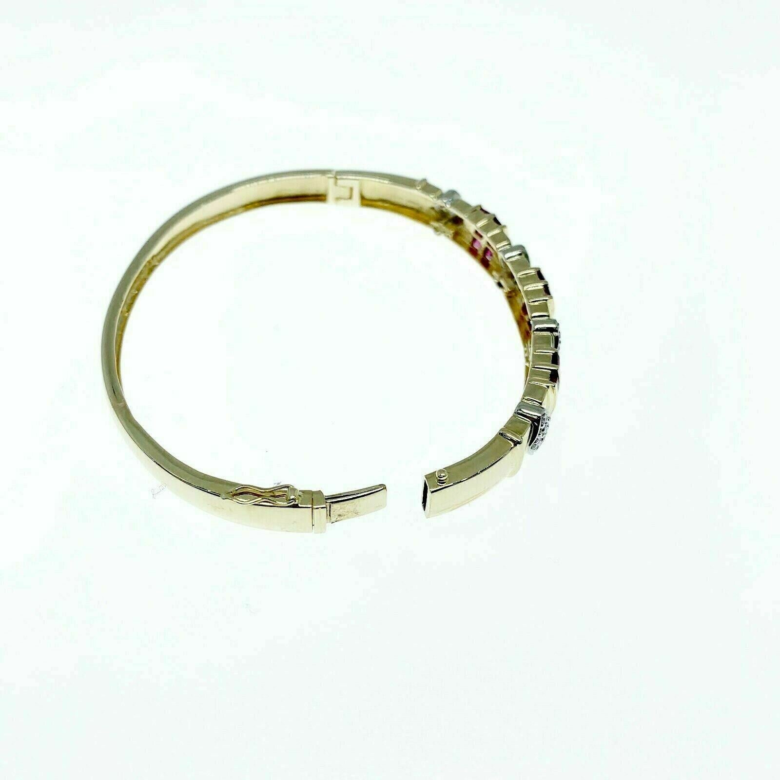 1.32 Carats t.w. 14K Yellow Gold Diamond and Ruby Bangle Bracelet