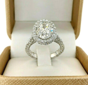 5.46 Carats t.w. Oval Cut Diamond Puffed Halo 3 Sided Pave Engagement Ring Plat