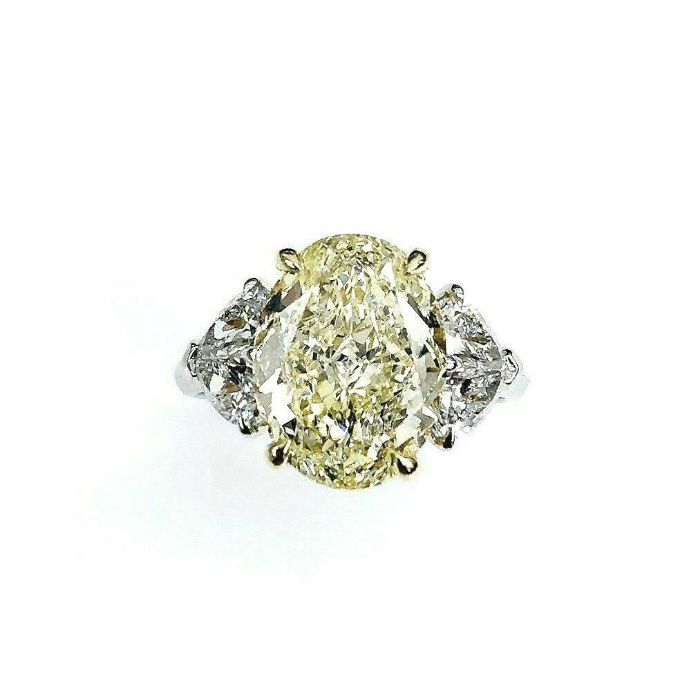 GIA Certified 5.45ct Oval Shape Fancy Yellow Canary Diamond Engagement Ring