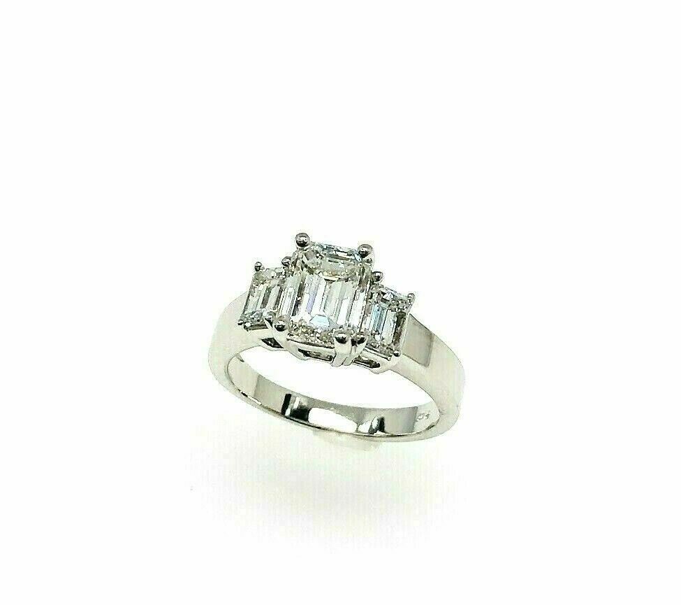 2.54 Carats t.w. 3 Stone Emerald Cut Diamond Wedding Ring GIA 1.64 G VVS2 Center